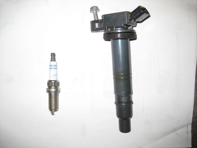 ignition coil on right which fits over and onto the spark plug