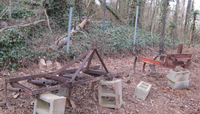 these tractor implements were given to me. the closest weighs >400lbs and would have been hard work to move without the bobcat