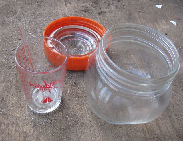 some of my utensils - a glass stirring rod, a measuring beaker and a jar to hold the solution being tested