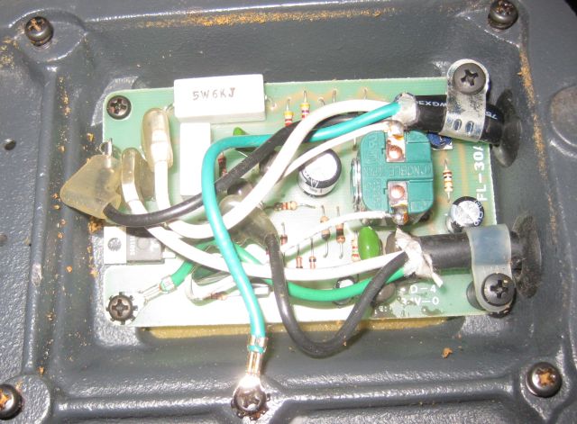 the pcb attached to the base of the saw. AC volts come in top right and DC volts go out bottom right