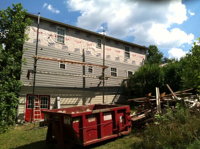 the contractor used pump jack scaffolding - platform is raised by a foot pump operated simultaneously by an individual at each end, and lowered with a hand crank