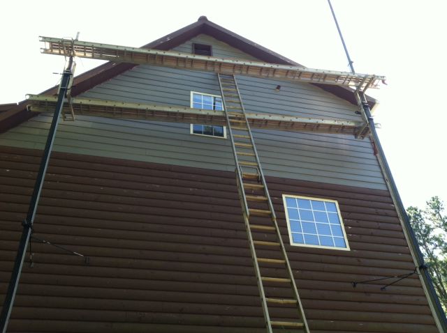 the east side is 3 levels plus gables, you can see the paint work on the remaining wood siding has slightly deteriorated