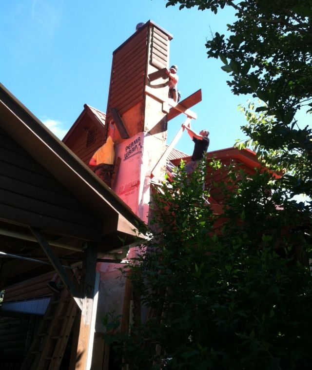 the chimney was intricate and took 2 days, here they are removing the old wood siding