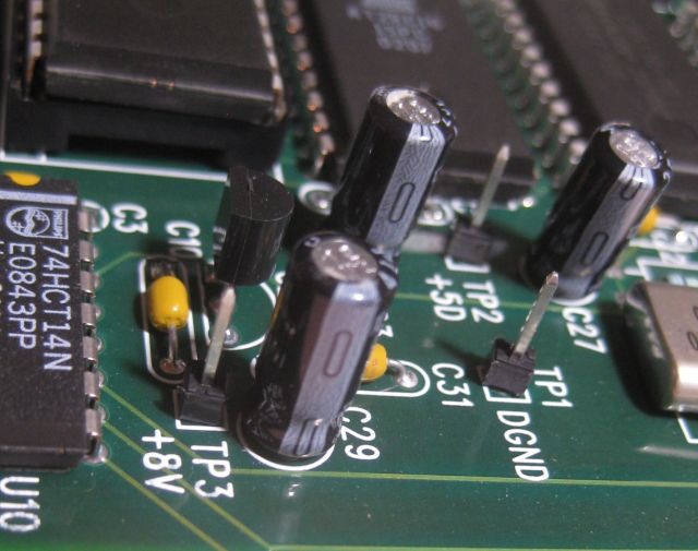 all the capacitors have the same value 47uF @ 25v. when replacing polarity must be observed - the light grey band signifies the negative leg