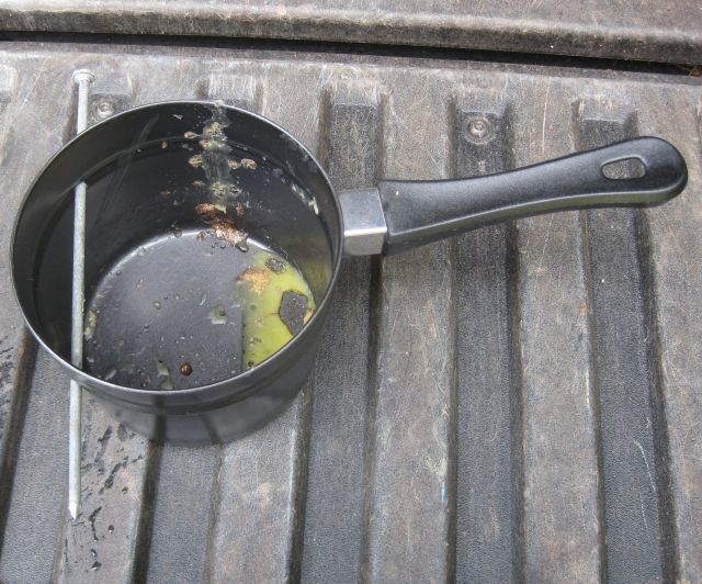 the pot will only be used for beeswax so driving a nail through the side opposite the handle does not detract from it function