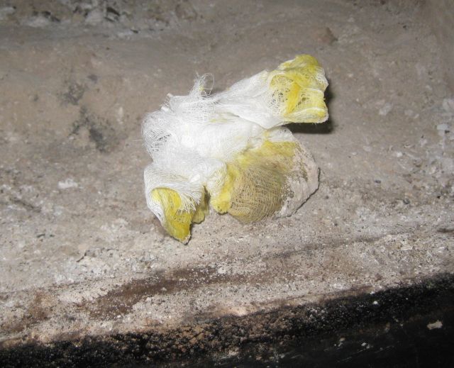 a scrunched bundle of cheesecloth, wax and debris for a fire starter